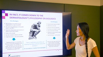 Hummingbird Insight's managing director, Nayana Wade presenting a powerpoint slide about qualitative research in a board room