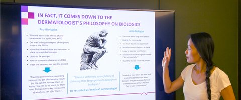 Hummingbird Insight's managing director, Nayana Wade presenting a powerpoint slide about qualitative research in a board room