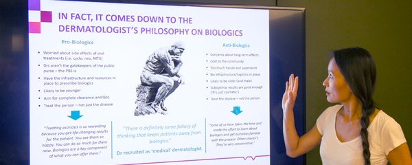 Hummingbird Insight's managing director, Nayana Wade presenting a powerpoint slide about qualitative research in a board room